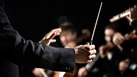 how to master music: the role of a conductor in orchestrating musical symphonies